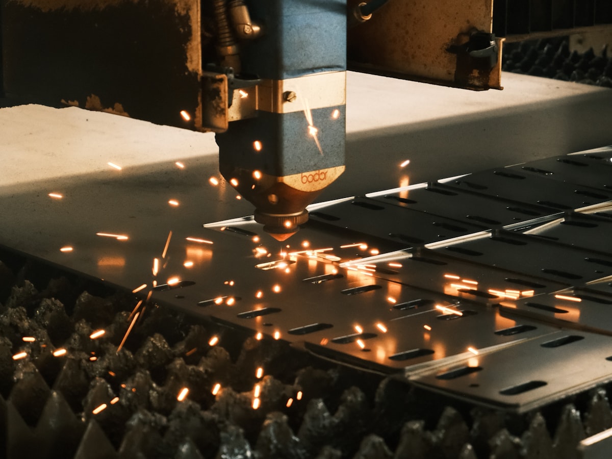 CNC machine cutting a steel plate